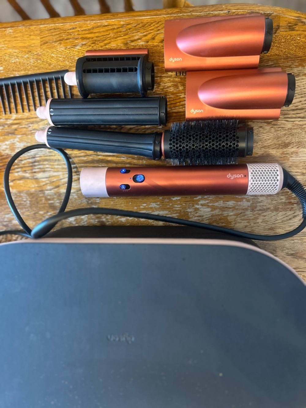 Dyson Airwrap multi-styler attachments in metallic copper and rose